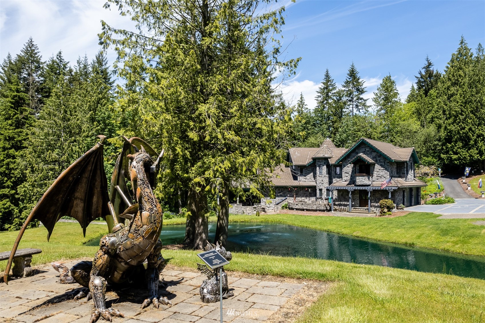 21632 High Rock Road Monroe, WA 98272 - Photo 26 of 40 a front view of a house with garden and trees