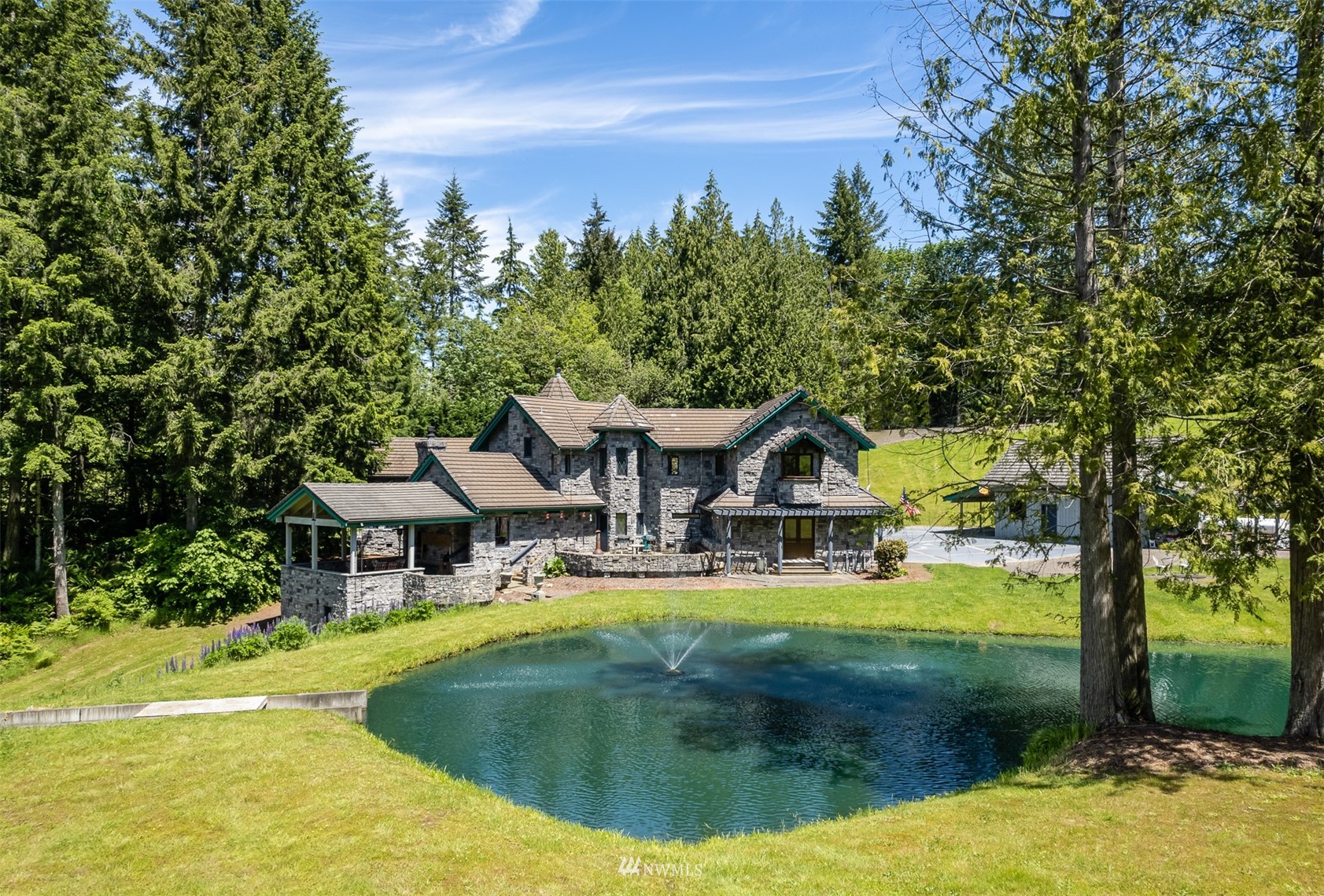 21632 High Rock Road Monroe, WA 98272 - Photo 28 of 40 a view of a house with swimming pool and yard