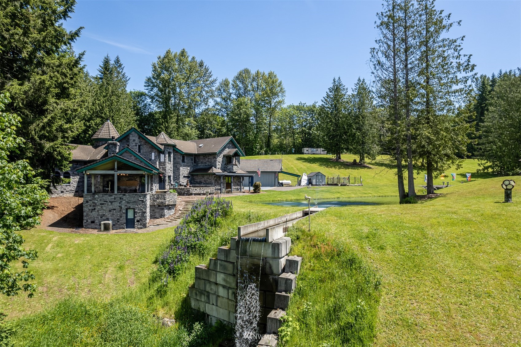 21632 High Rock Road Monroe, WA 98272 - Photo 29 of 40 a view of an house with swimming pool garden and trees