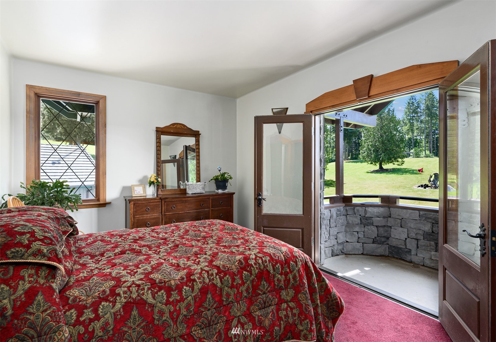 21632 High Rock Road Monroe, WA 98272 - Photo 6 of 40 a bedroom with a bed and a large window