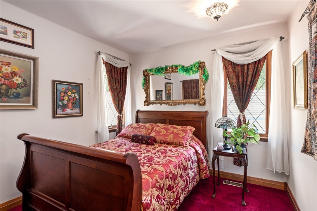 21632 High Rock Road Monroe, WA 98272 - Photo 7 of 40 a bedroom with a bed potted plant on the dresser and a window