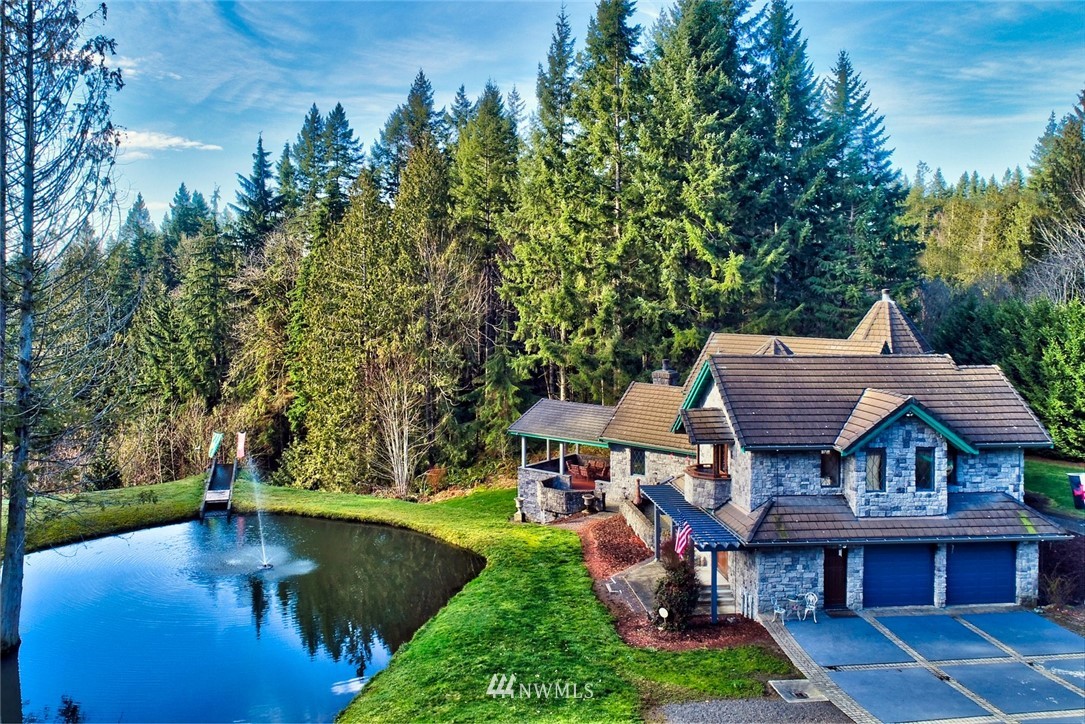 21632 High Rock Road Monroe, WA 98272 - Photo 9 of 40 a aerial view of a house with a yard table and chairs