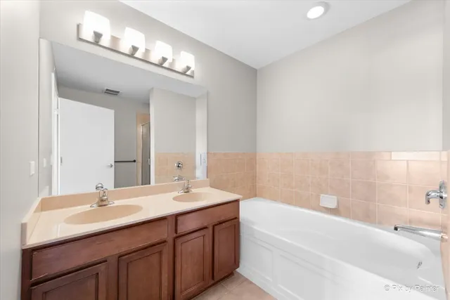 a view of an empty room with a ceiling fan