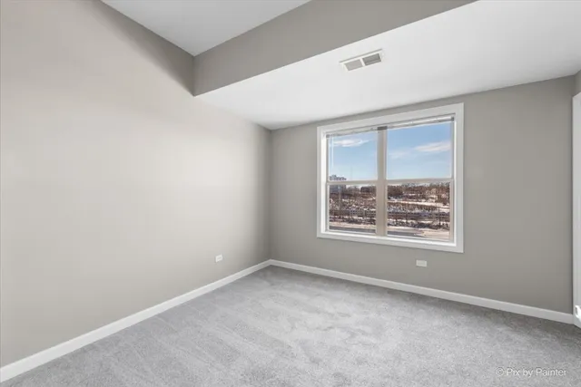 a view of a room with a large window