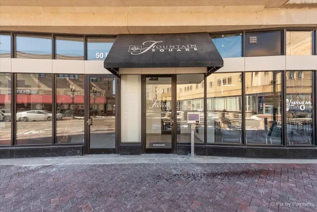 a view of a brick building with a large window
