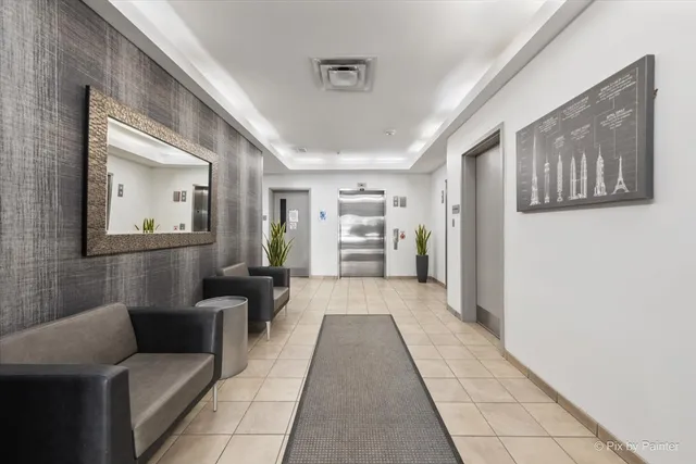 a hallway with furniture and window