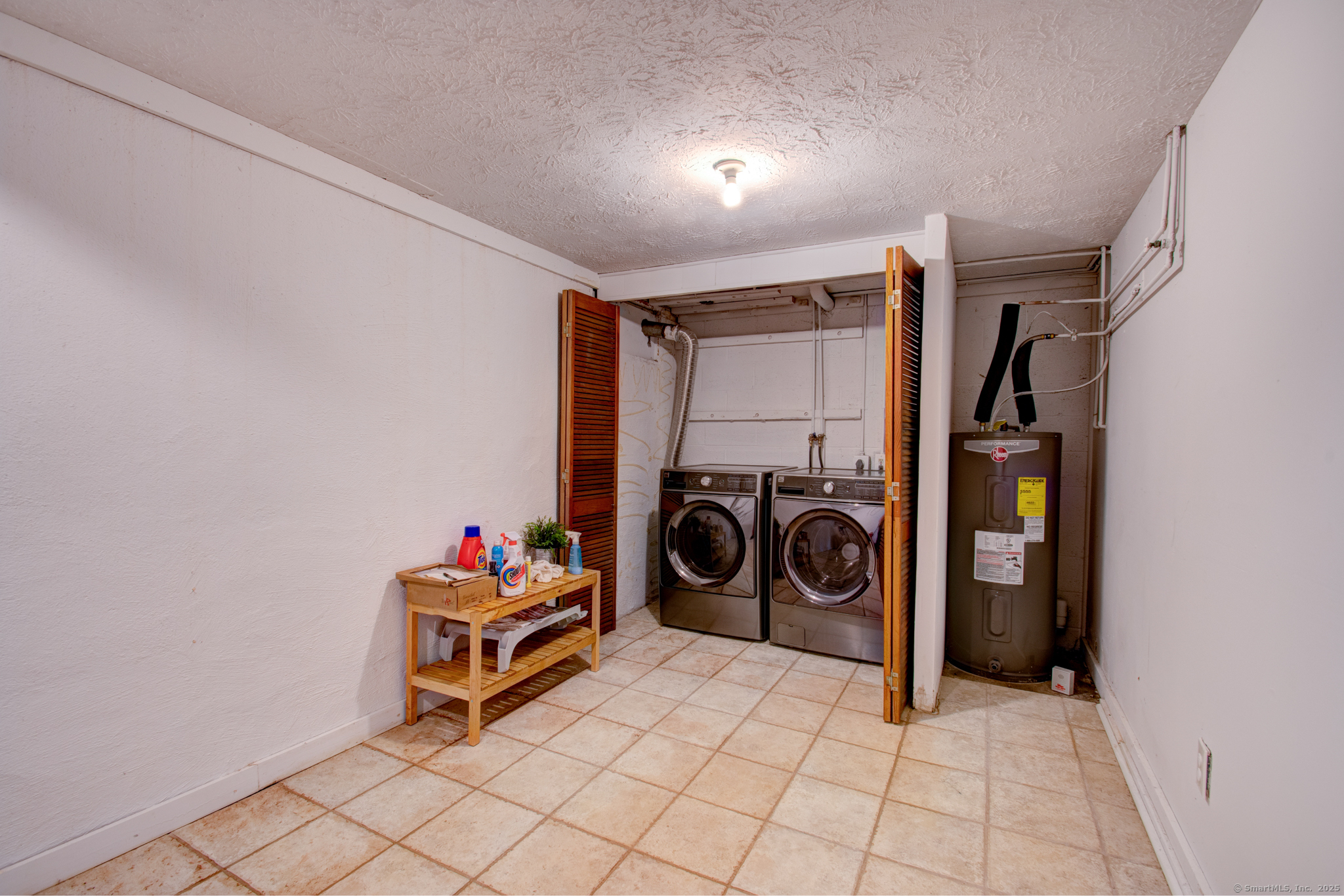 184 Gravel Street, Unit 26 Meriden, CT 06450 - Photo 24 of 27 a view of a storage & utility room with washer and dryer