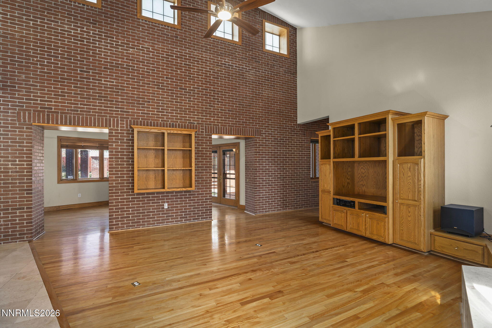 2425 Foley Way Reno, NV 89509 - Photo 18 of 73 a view of empty room with wooden floor and fireplace