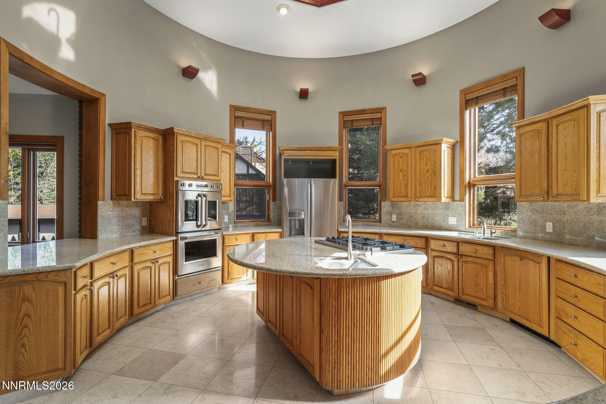 2425 Foley Way Reno, NV 89509 - Photo 20 of 73 a bathroom with a granite countertop sink and a large mirror
