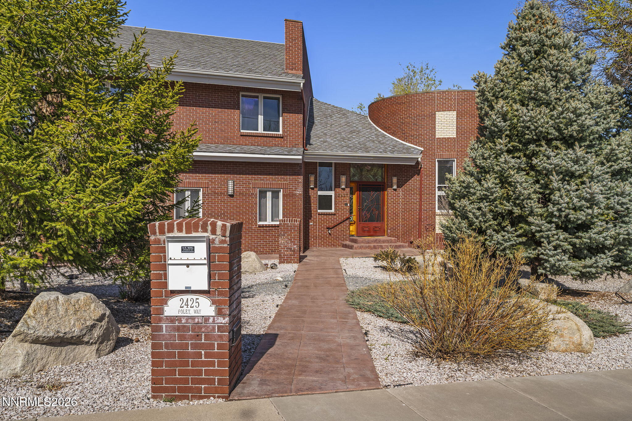 2425 Foley Way Reno, NV 89509 - Photo 2 of 73 a front view of a house with a yard