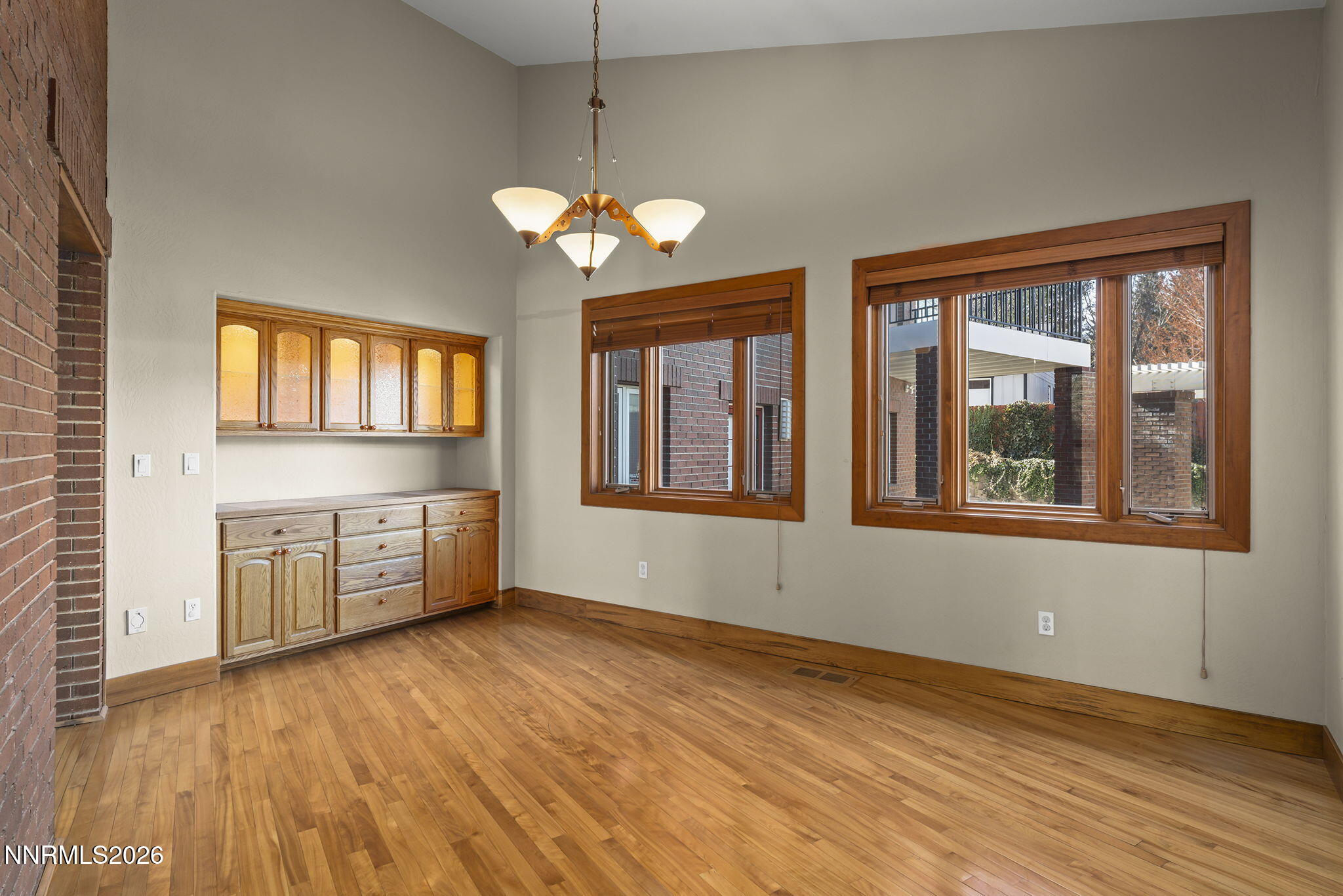 2425 Foley Way Reno, NV 89509 - Photo 23 of 73 a view of an empty room with a window and wooden floor