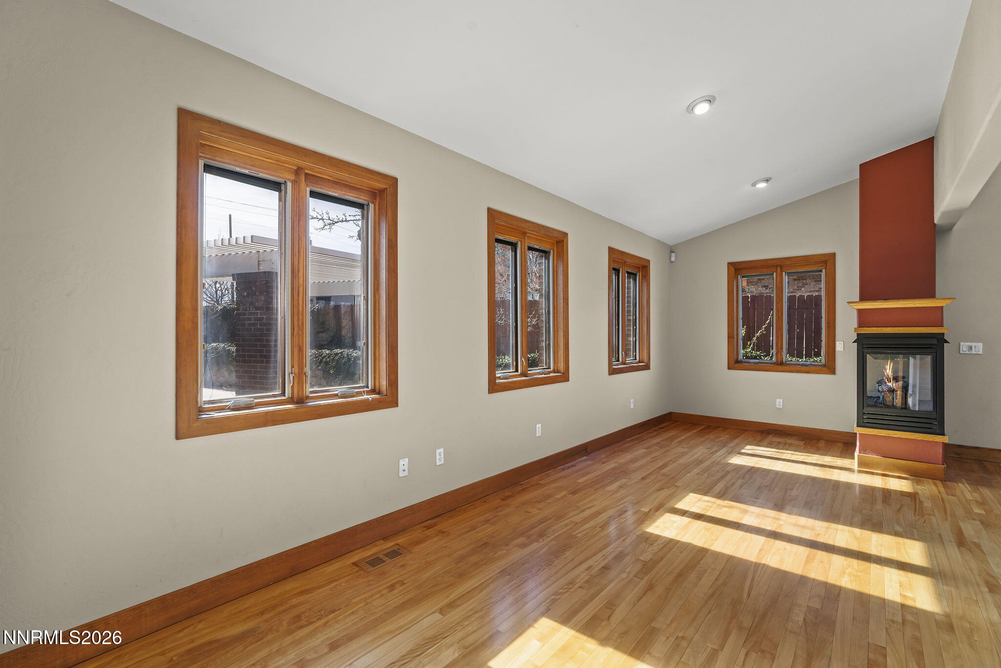2425 Foley Way Reno, NV 89509 - Photo 27 of 73 a view of an empty room with wooden floor and a window