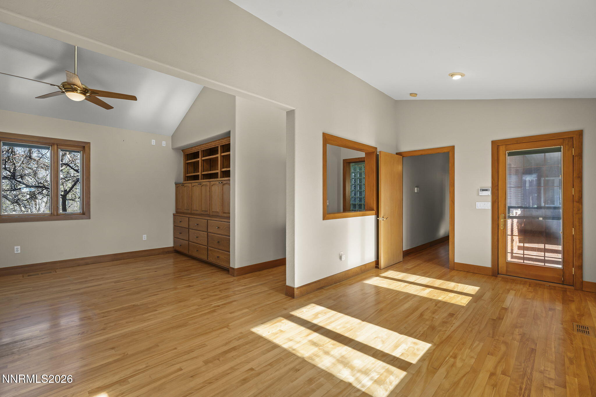 2425 Foley Way Reno, NV 89509 - Photo 31 of 73 a view of an empty room with window and wooden floor