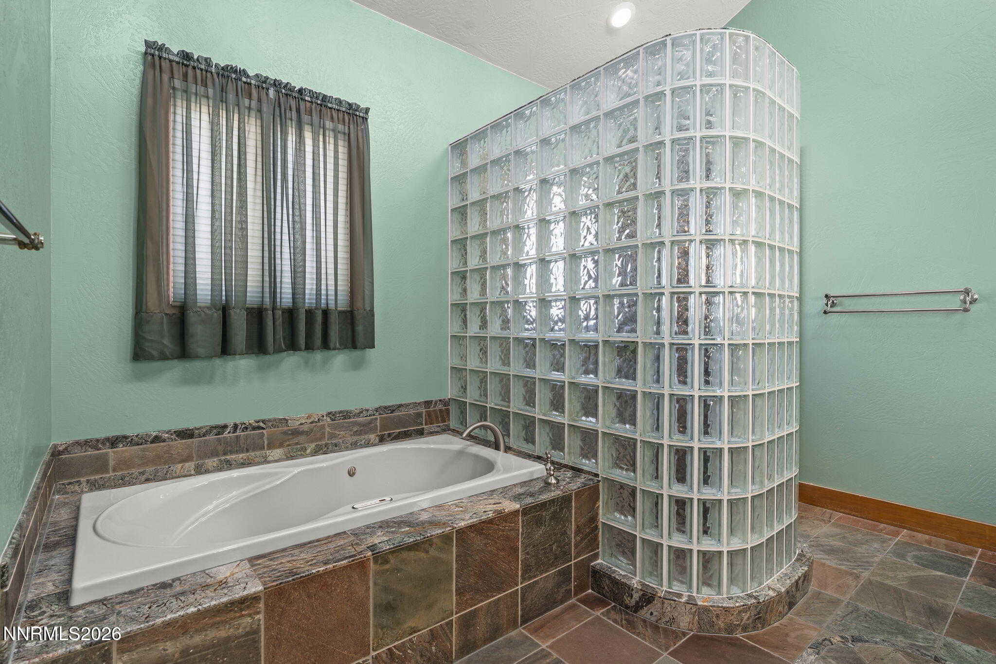 2425 Foley Way Reno, NV 89509 - Photo 34 of 73 a bathroom with a bathtub and shower