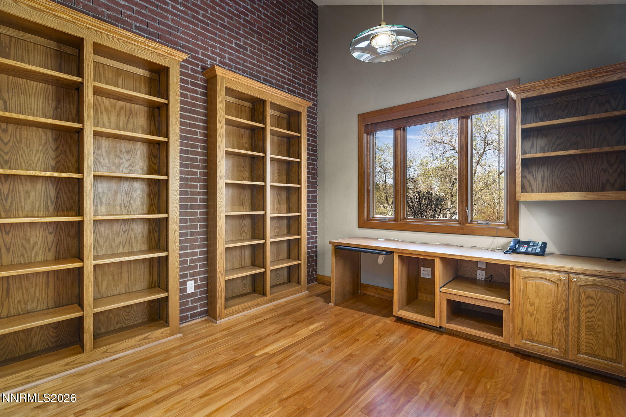2425 Foley Way Reno, NV 89509 - Photo 38 of 73 a view of an empty room with a window and wooden floor