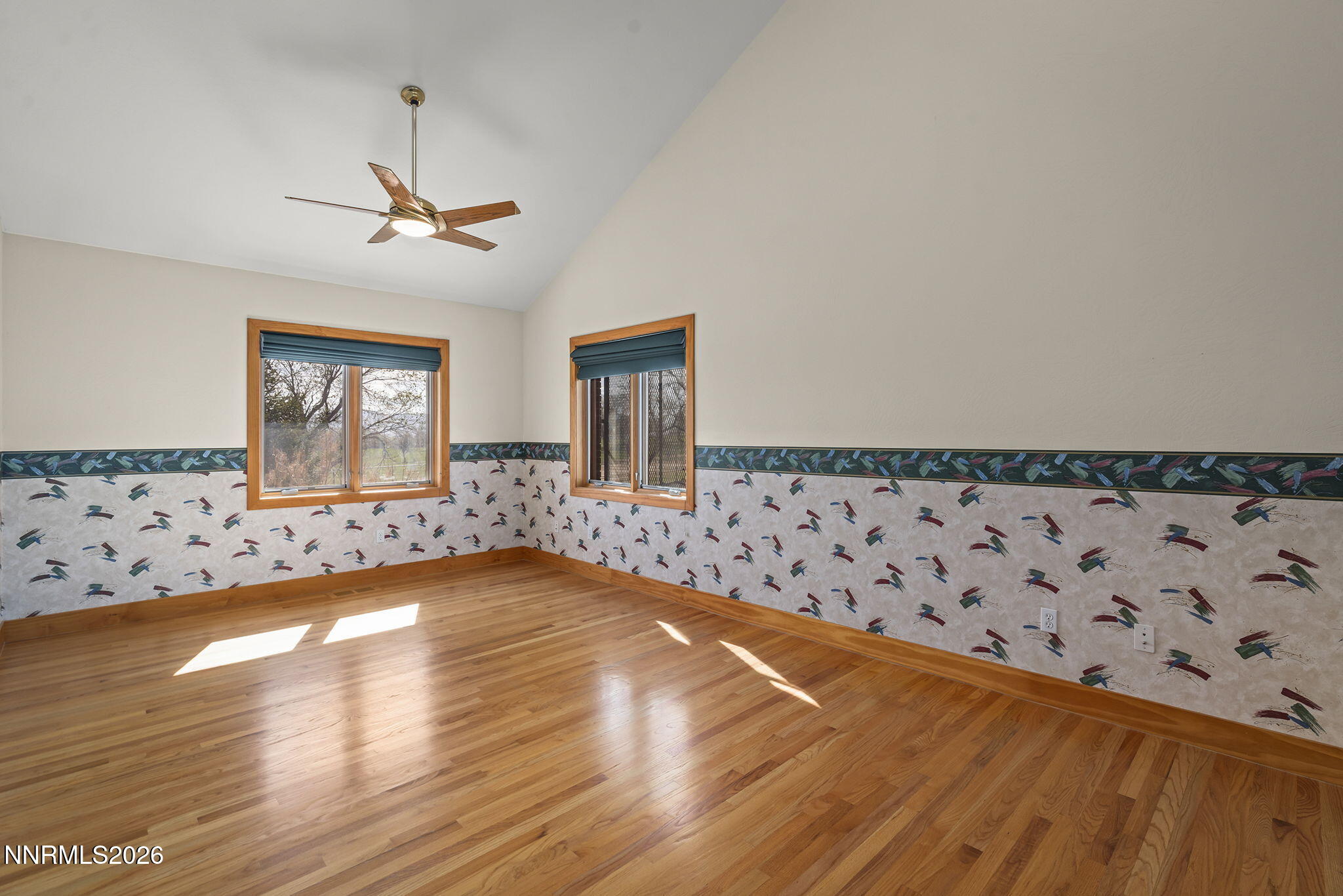 2425 Foley Way Reno, NV 89509 - Photo 46 of 73 a view of an empty room with window and wooden floor