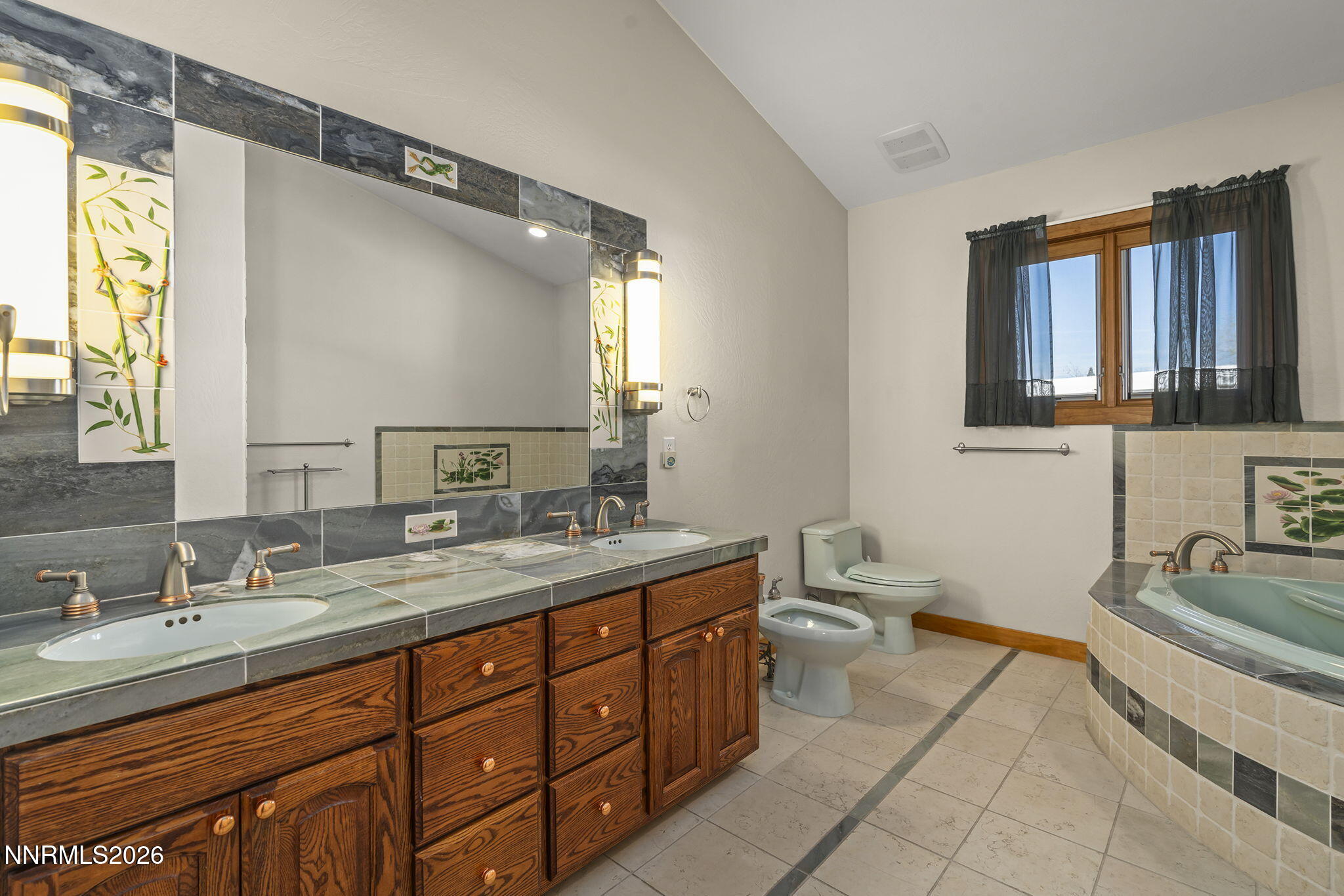 2425 Foley Way Reno, NV 89509 - Photo 48 of 73 a spacious bathroom with a granite countertop double vanity sink a mirror and a