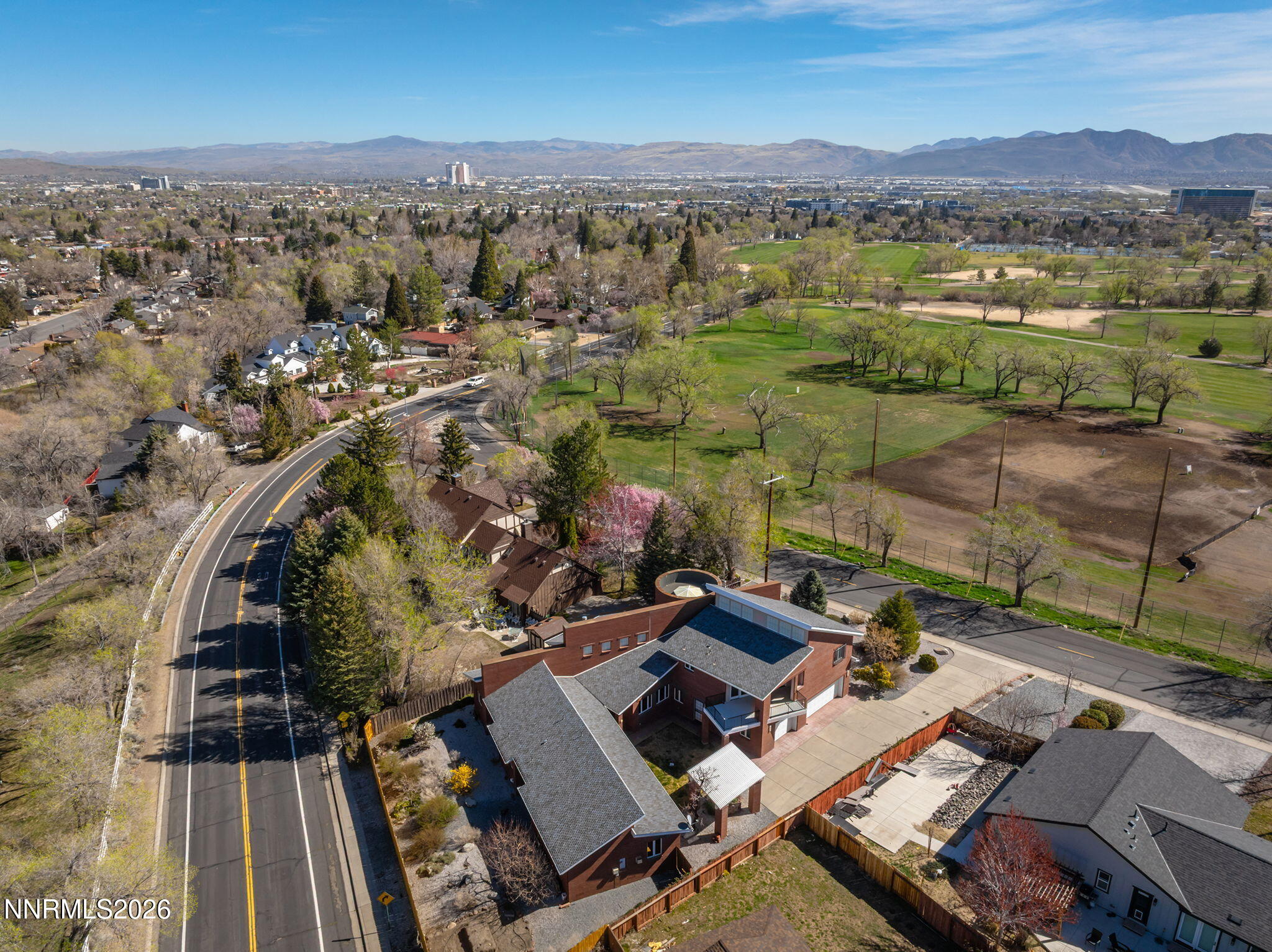 2425 Foley Way Reno, NV 89509 - Photo 69 of 73 an aerial view of a city with lots of residential buildings and mountain view in back