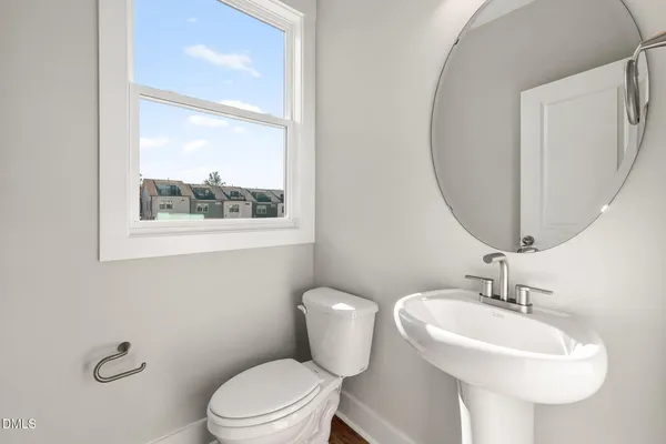 an empty room with windows and ceiling fan