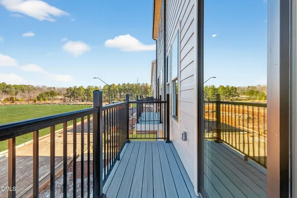 a view of balcony with wooden floor