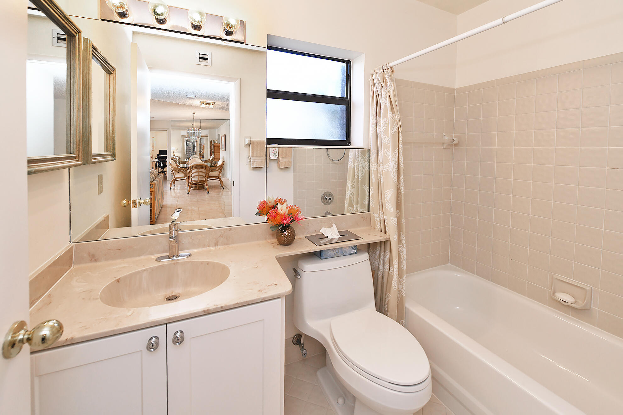 8541 Boca Glades Boulevard West, Unit A Boca Raton, FL 33434 - Photo 22 of 41 a bathroom with a sink toilet and shower