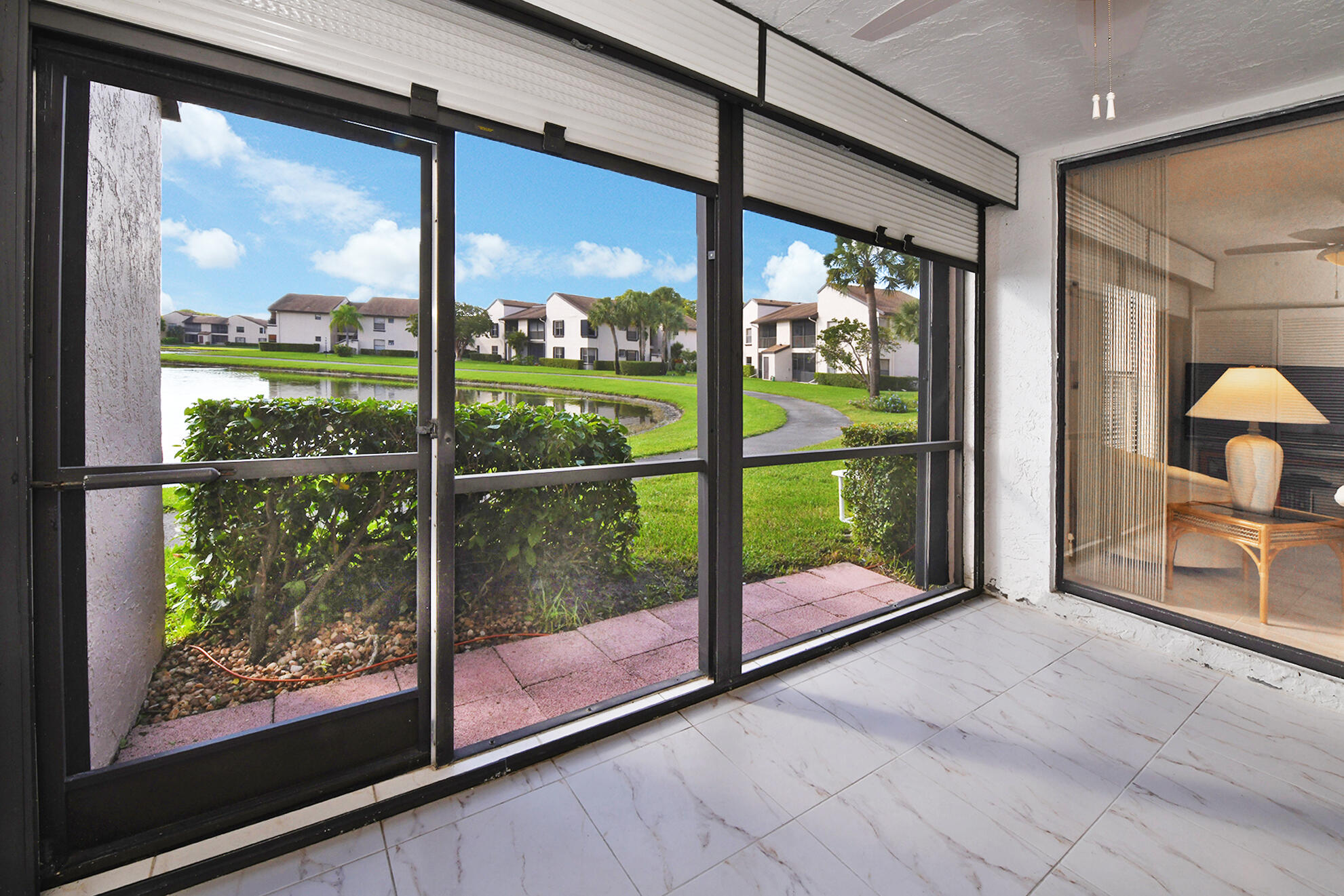 8541 Boca Glades Boulevard West, Unit A Boca Raton, FL 33434 - Photo 24 of 41 a view of a room with window and an outdoor space