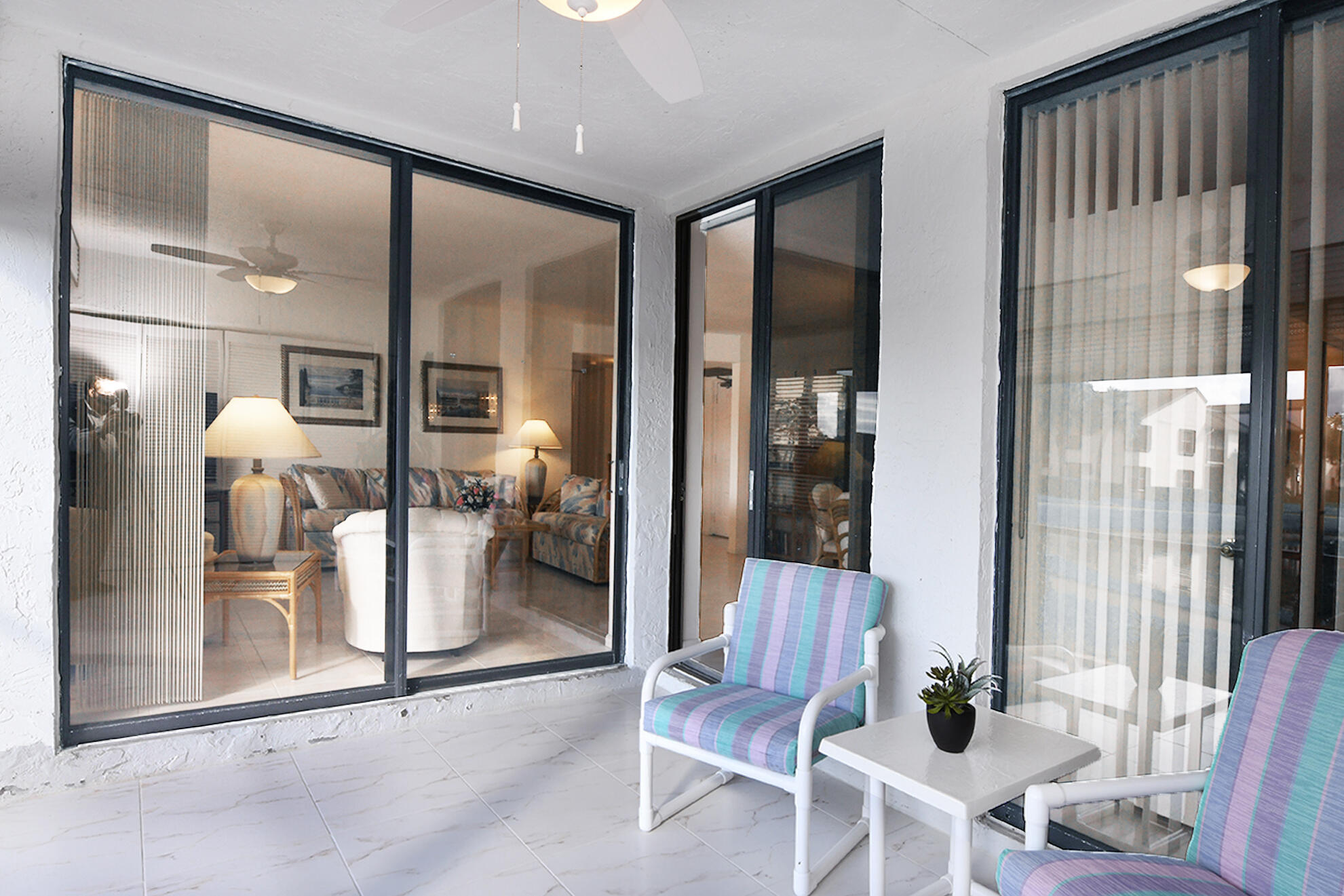 8541 Boca Glades Boulevard West, Unit A Boca Raton, FL 33434 - Photo 25 of 41 a room with a glass door and furniture