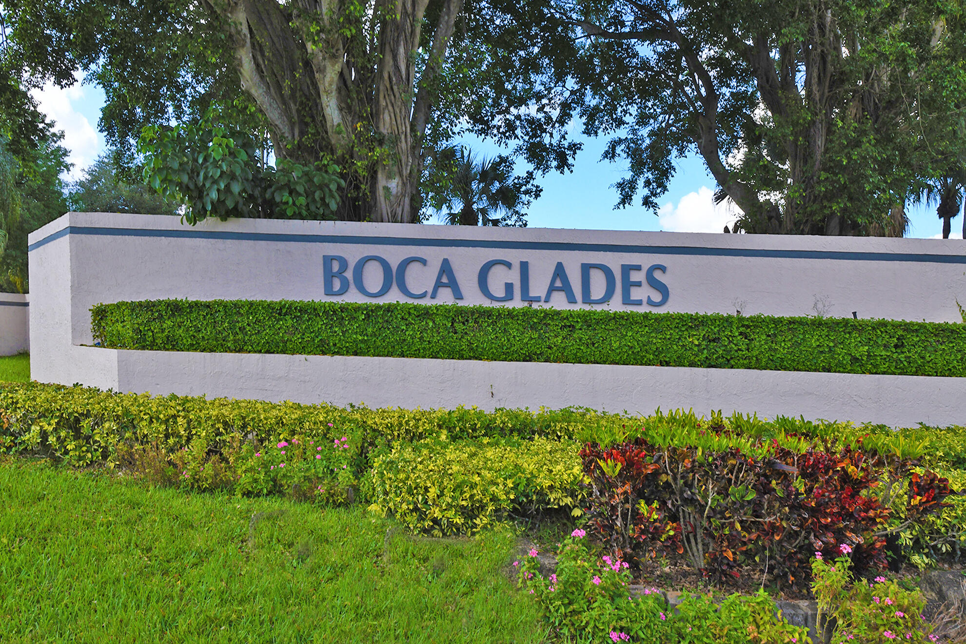 8541 Boca Glades Boulevard West, Unit A Boca Raton, FL 33434 - Photo 27 of 41 a view of a yard with a house