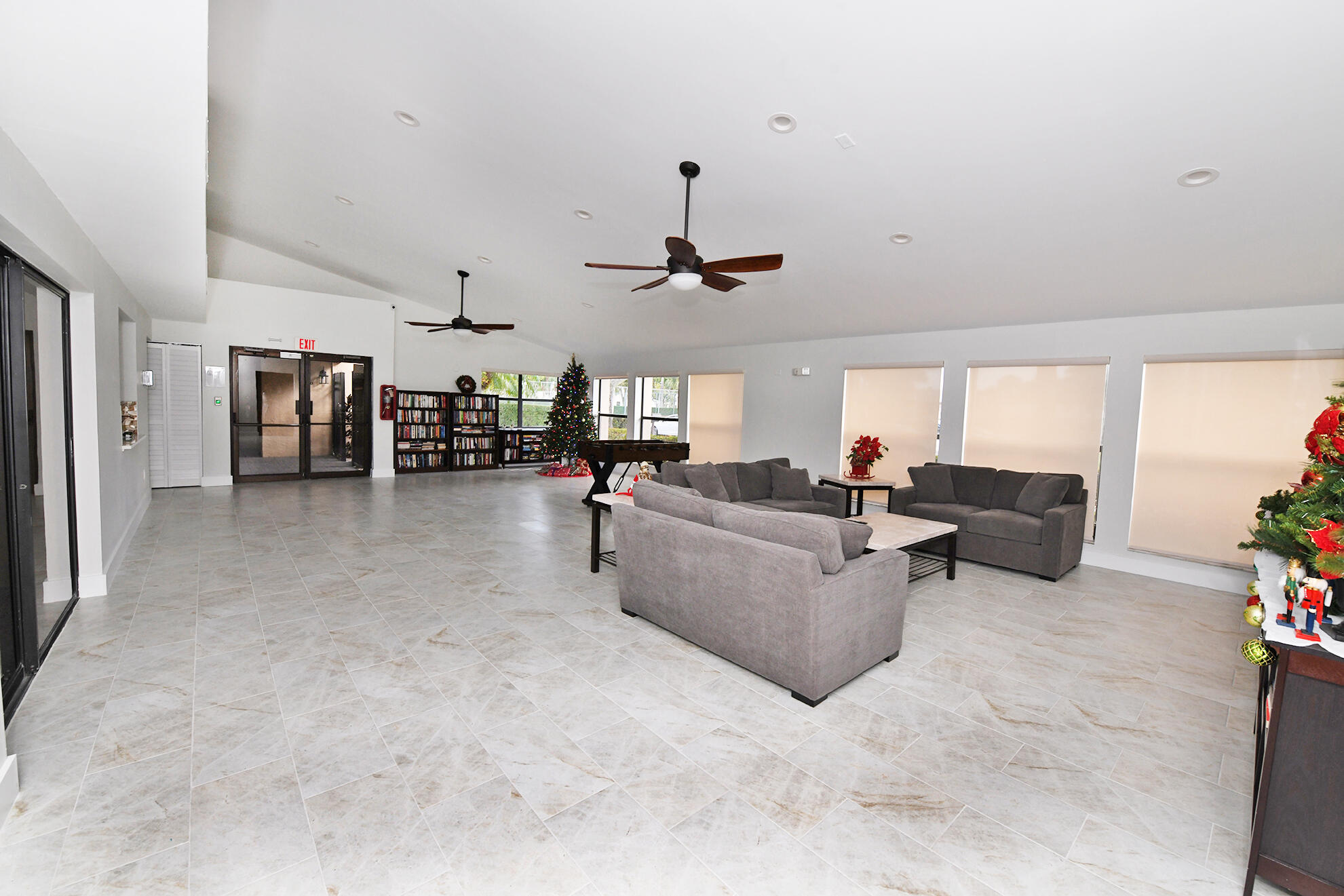 8541 Boca Glades Boulevard West, Unit A Boca Raton, FL 33434 - Photo 29 of 41 a living room with furniture and a ceiling fan