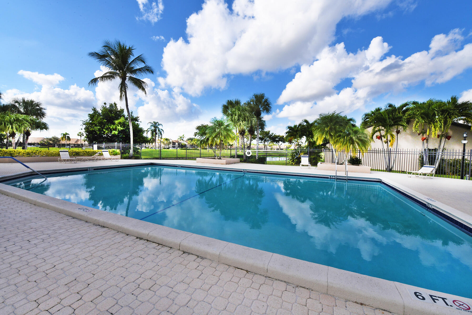 8541 Boca Glades Boulevard West, Unit A Boca Raton, FL 33434 - Photo 34 of 41 a view of swimming pool with a yard