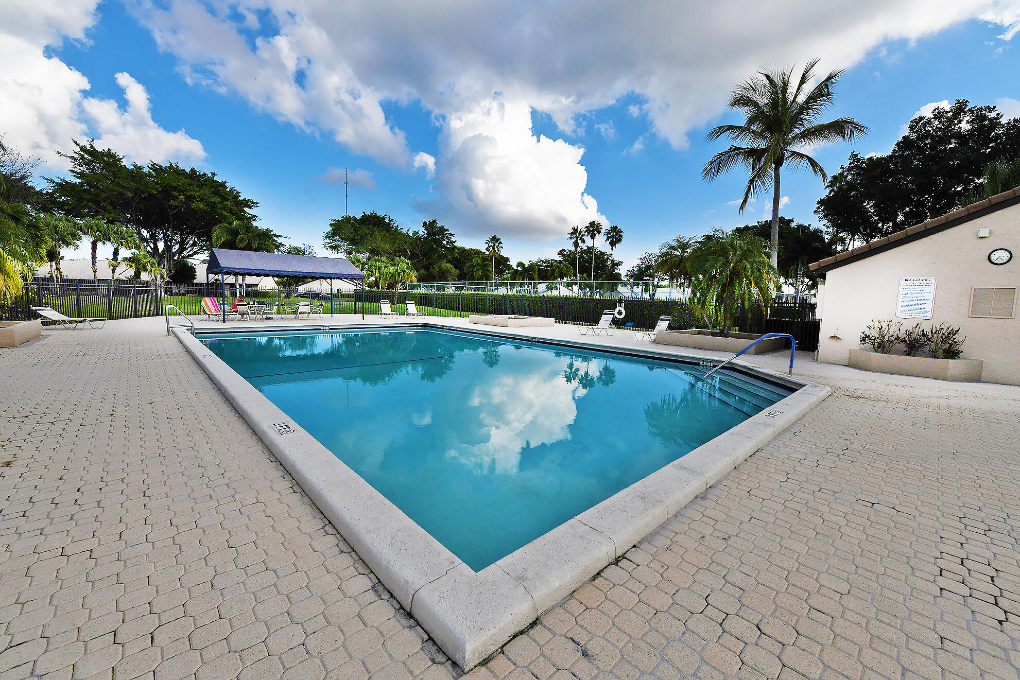 8541 Boca Glades Boulevard West, Unit A Boca Raton, FL 33434 - Photo 36 of 41 a view of swimming pool from a balcony