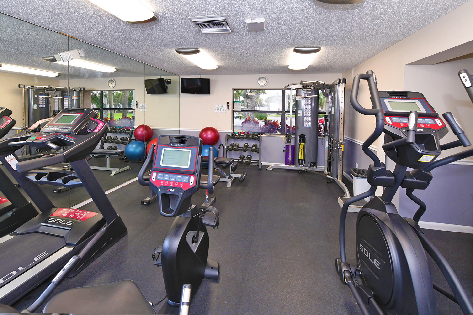 8541 Boca Glades Boulevard West, Unit A Boca Raton, FL 33434 - Photo 37 of 41 a view of a room with gym equipment