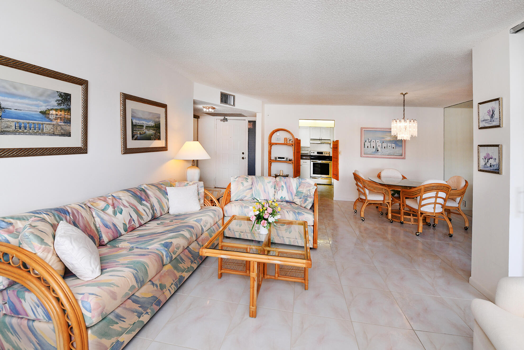 8541 Boca Glades Boulevard West, Unit A Boca Raton, FL 33434 - Photo 7 of 41 a living room with furniture and wooden floor