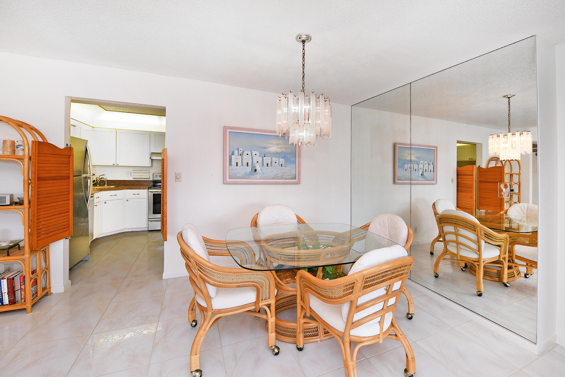8541 Boca Glades Boulevard West, Unit A Boca Raton, FL 33434 - Photo 8 of 41 a dining room with furniture and chandelier