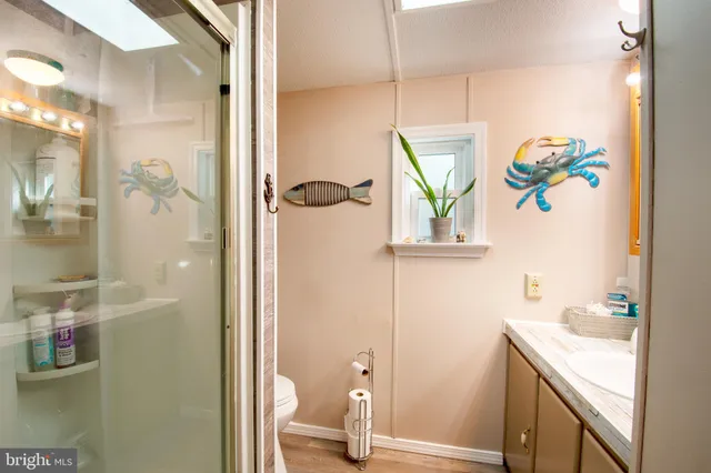 a bathroom with a shower and a sink