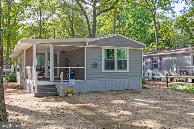 a backyard of a house with seating space