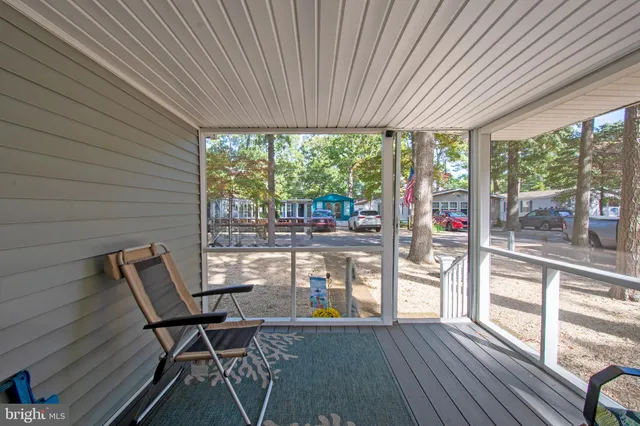 a view of a two chairs in the balcony