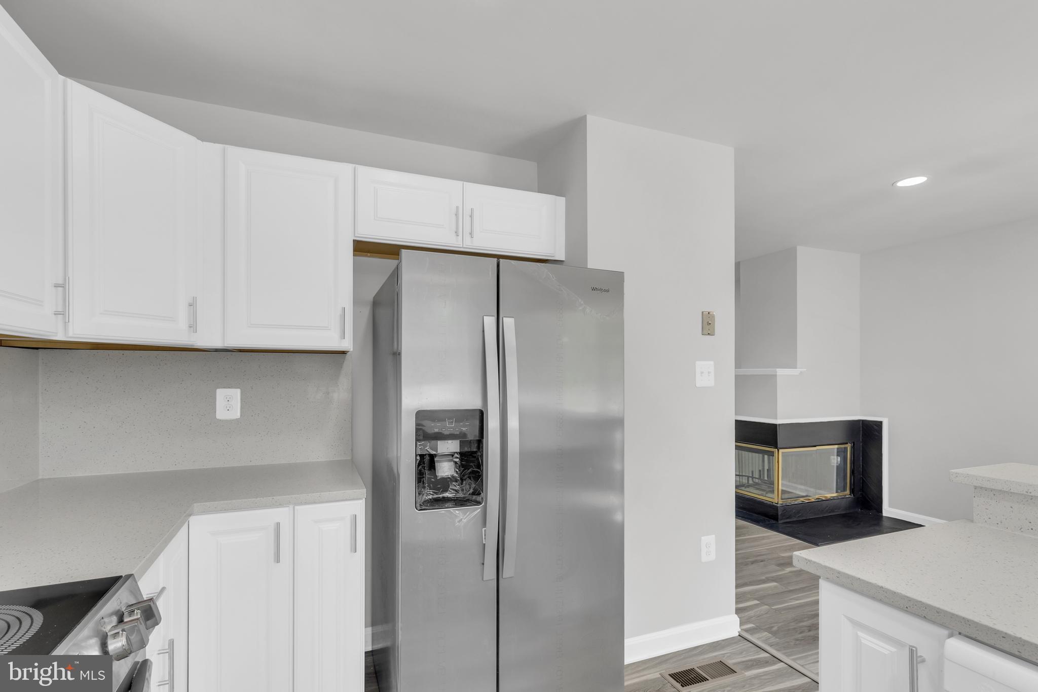 7635 Monitor Court Manassas, VA 20109 - Photo 11 of 46 a kitchen with a refrigerator and a sink