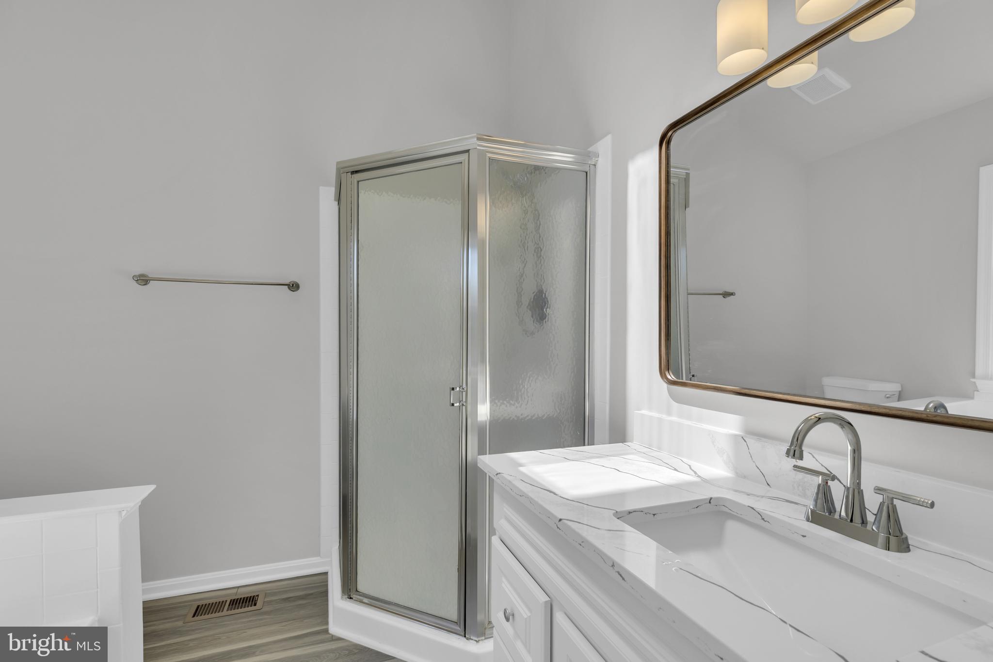 7635 Monitor Court Manassas, VA 20109 - Photo 18 of 46 a bathroom with a sink and a mirror