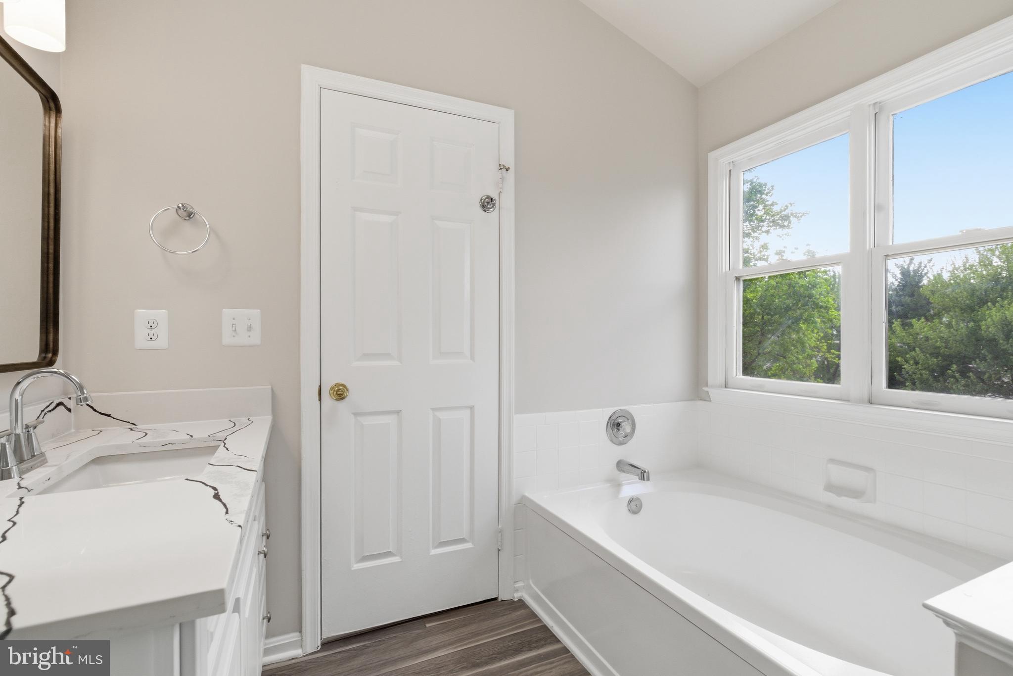 7635 Monitor Court Manassas, VA 20109 - Photo 19 of 46 a bathroom with a tub and a sink