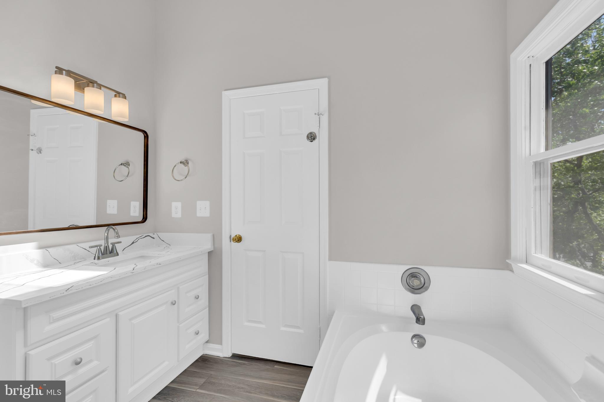 7635 Monitor Court Manassas, VA 20109 - Photo 20 of 46 a bathroom with a sink and a mirror
