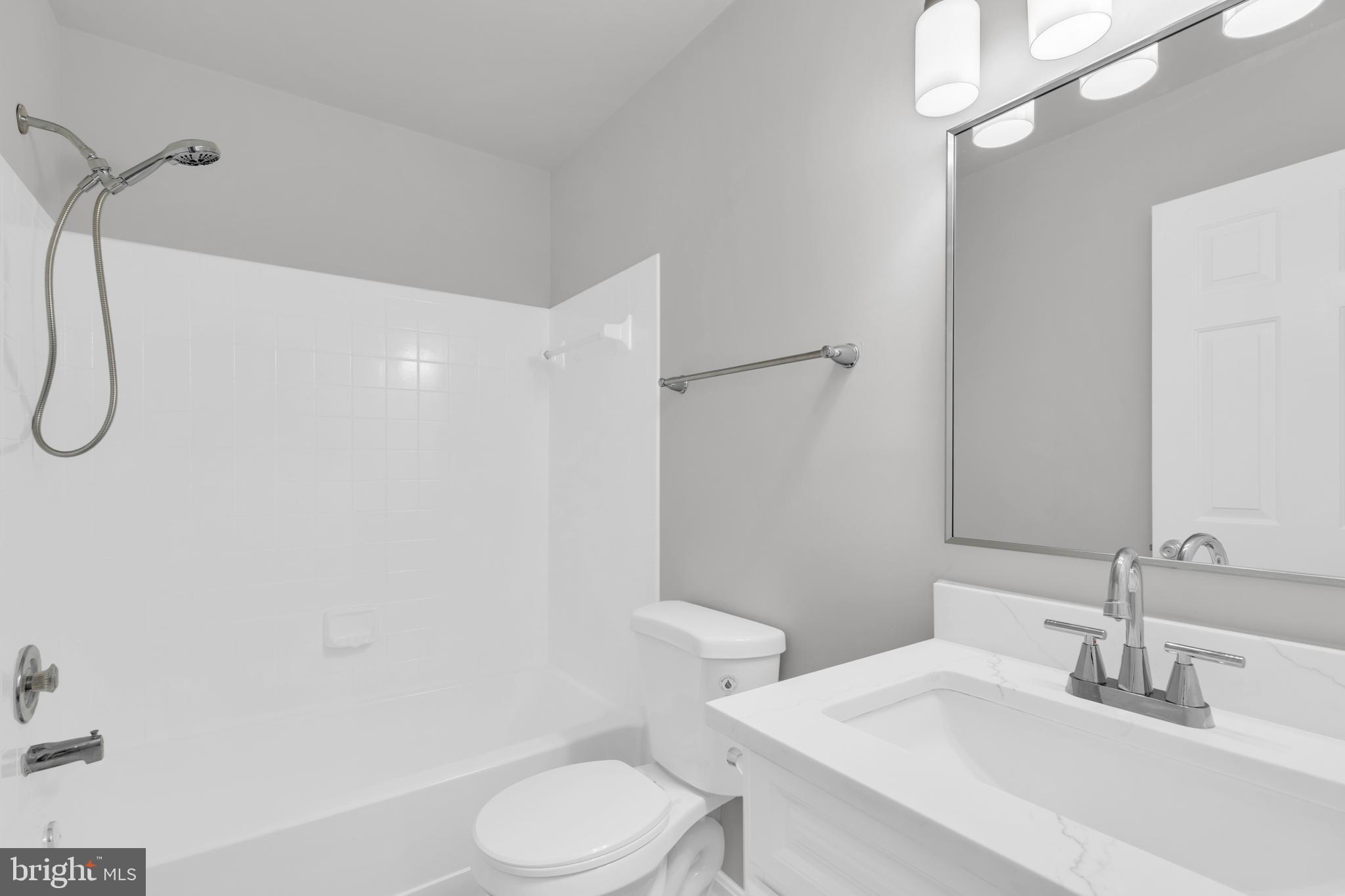 7635 Monitor Court Manassas, VA 20109 - Photo 26 of 46 a bathroom with a sink a toilet and shower