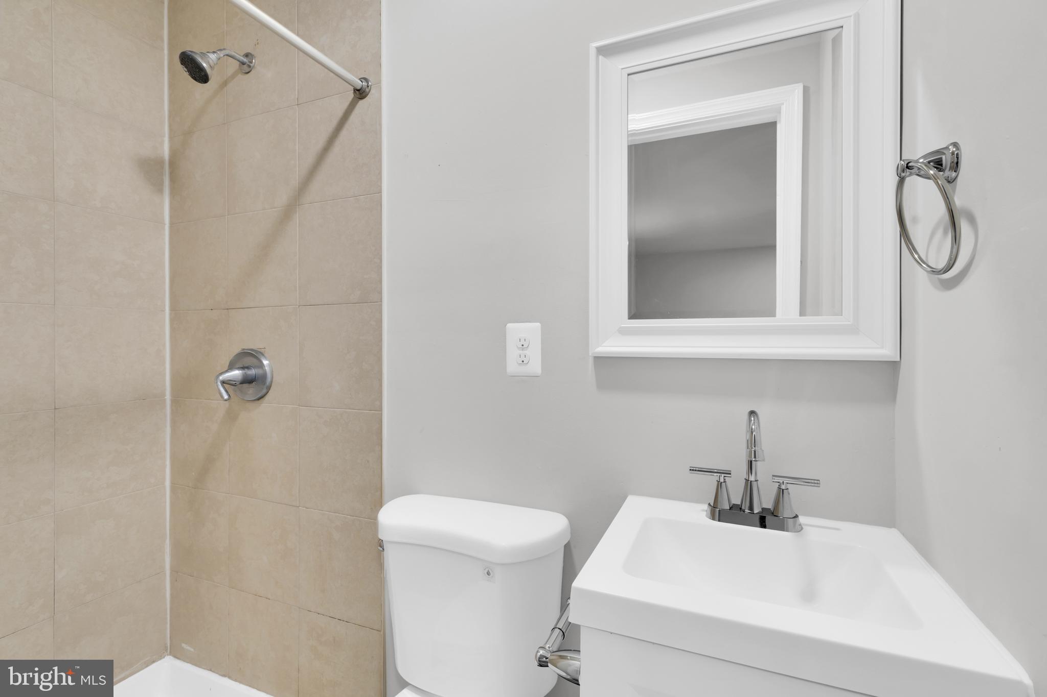 7635 Monitor Court Manassas, VA 20109 - Photo 30 of 46 a bathroom with a toilet sink vanity and shower