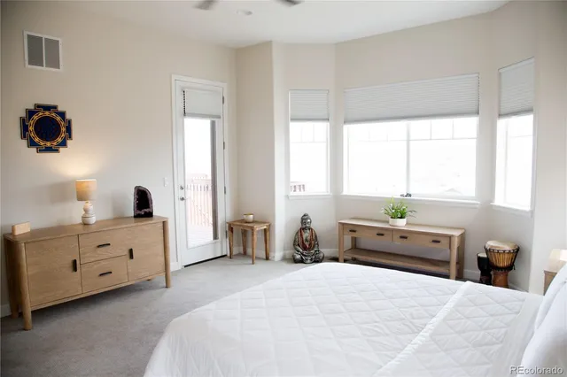 a bed room with a bed and a window