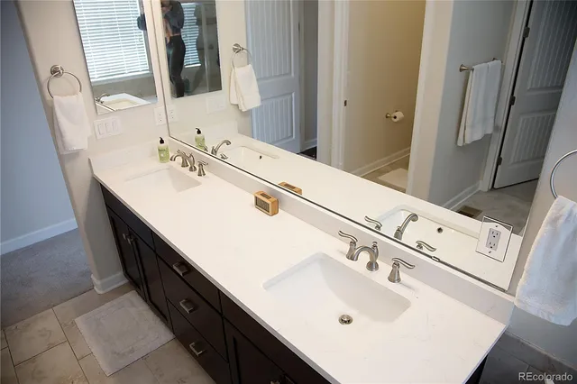 a utility room with sink and dryer