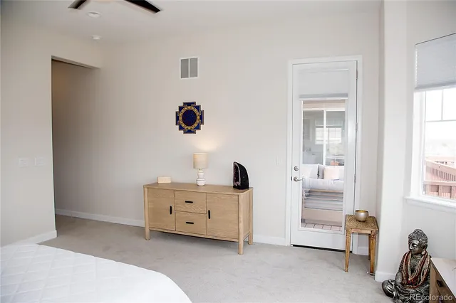 a room with a bed and a desk