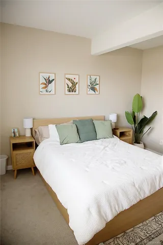 a bedroom with a bed and a couch