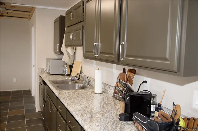 a kitchen with sink cabinets and outdoor view