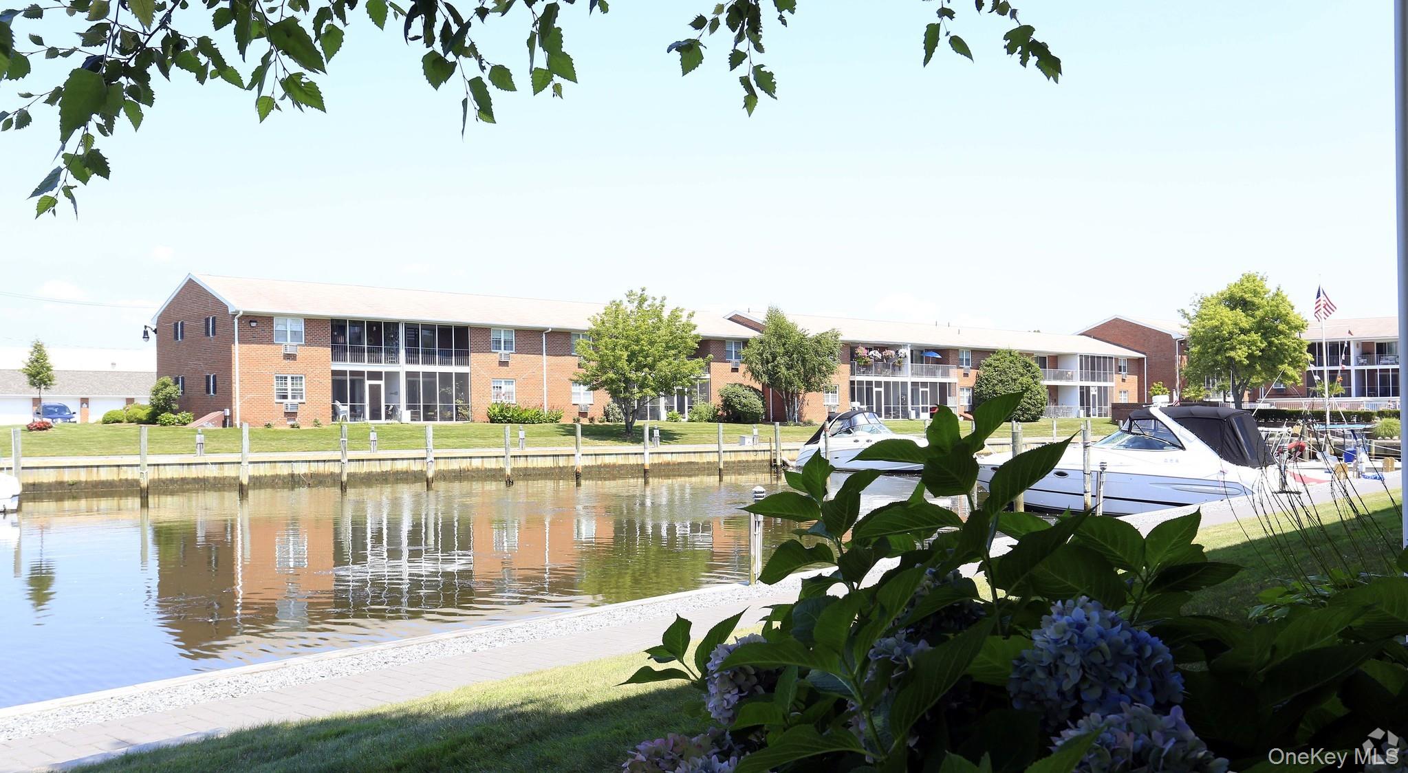 204 Milligan Road West Babylon, NY 11704 - Photo 2 of 11 a view of a lake with a house