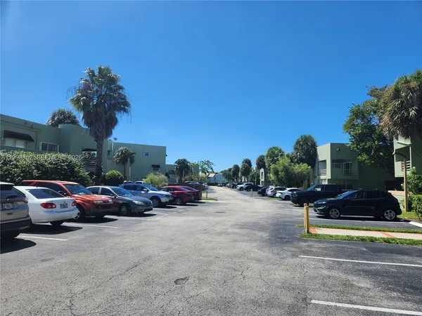 a view of a chairs and table on the wooden deck